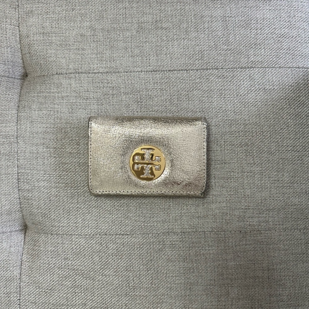 Tori Burch gold credit card case